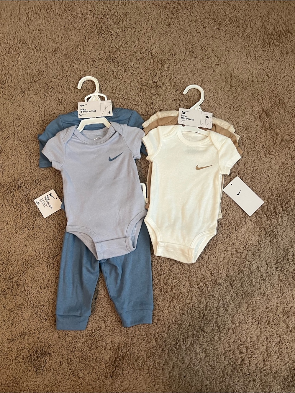Nike Baby Short-Sleeve Bodysuit Set in Light Blue, Blue, White, and Tan
